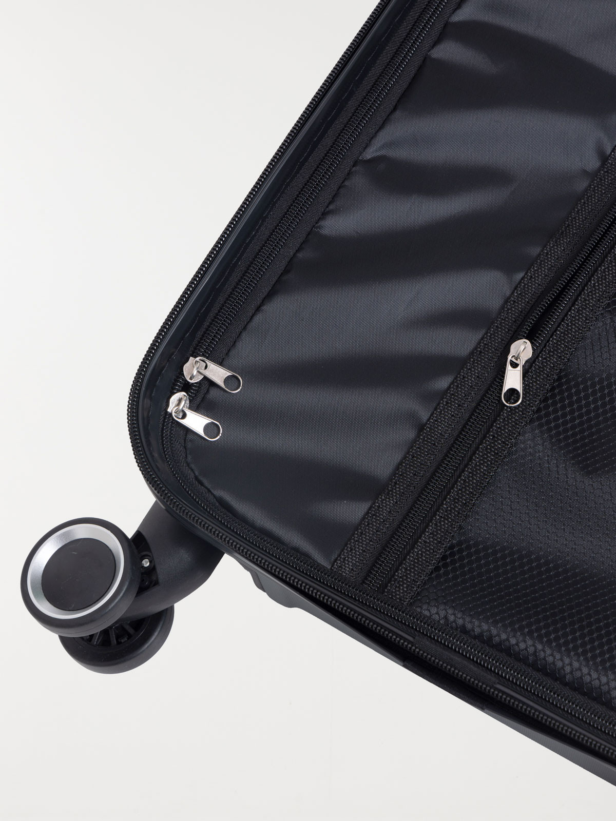 Valise rigide grise à roulettes 