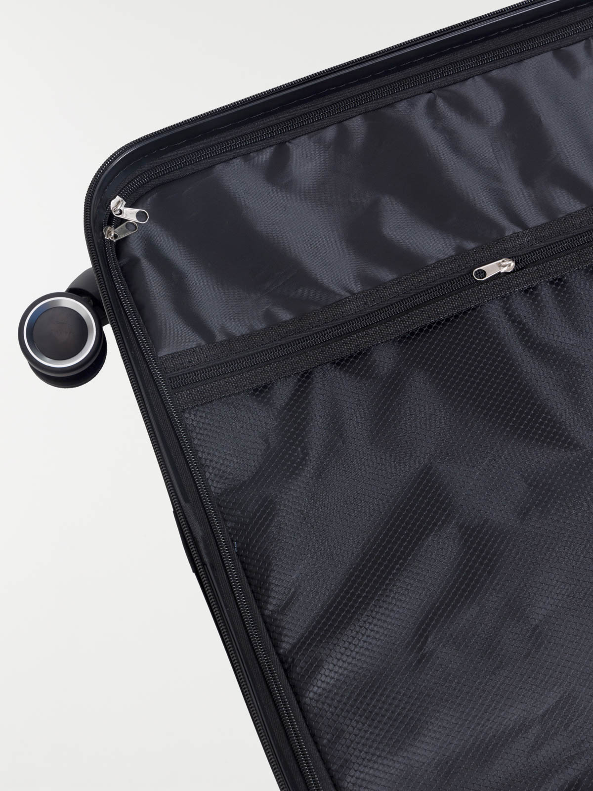 Valise rigide bleue à roulettes