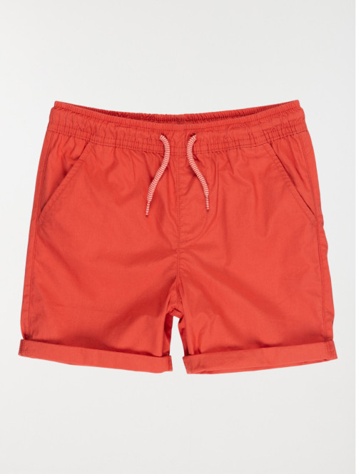 Short garçon rouge brulé...