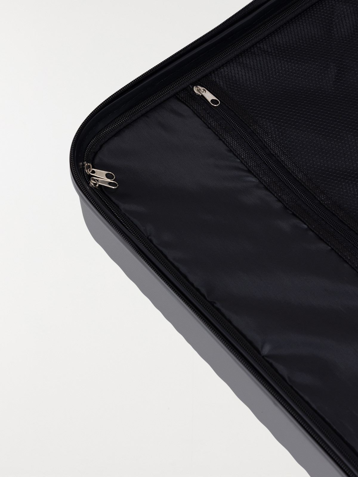 Valise rigide grise à roulettes Valise rigide grise à roulettes