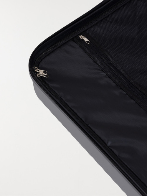 Valise rigide grise à roulettes Valise rigide grise à roulettes