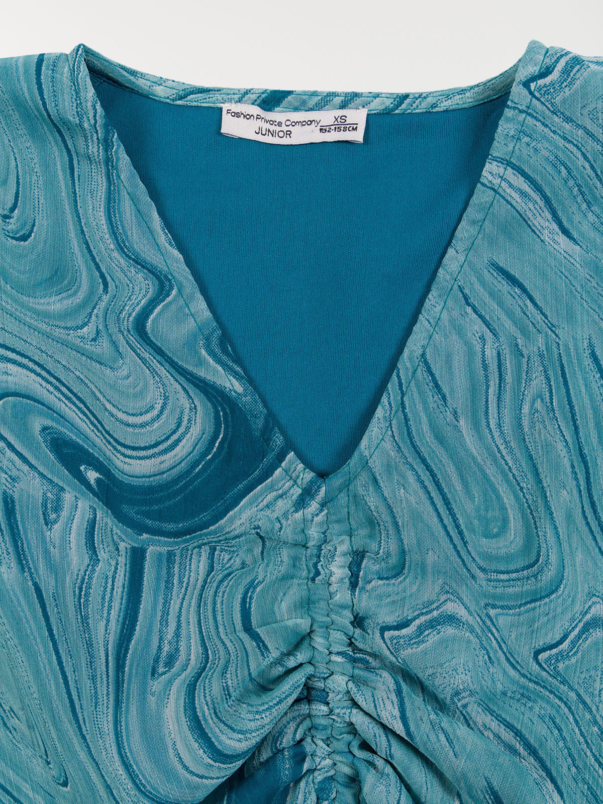 Blouse imprimée bleu paon fille (XXS-M) Blouse imprimée bleu paon fille (XXS-M)