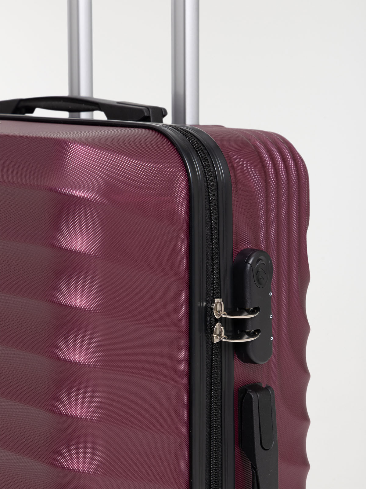 Valise rigide à roulettes rose