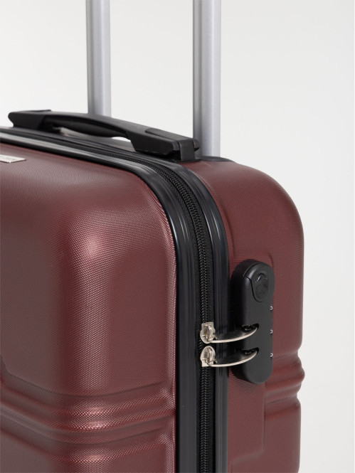 Valise rigide rouge à roulettes