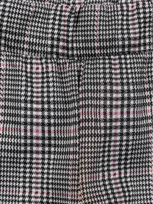 Pantalon évasé à carreaux...