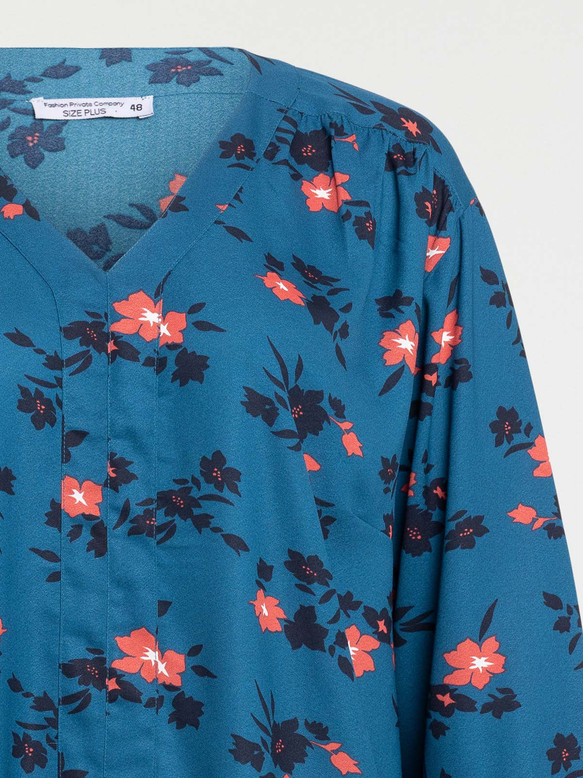 Blouse bleu paon grande taille femme