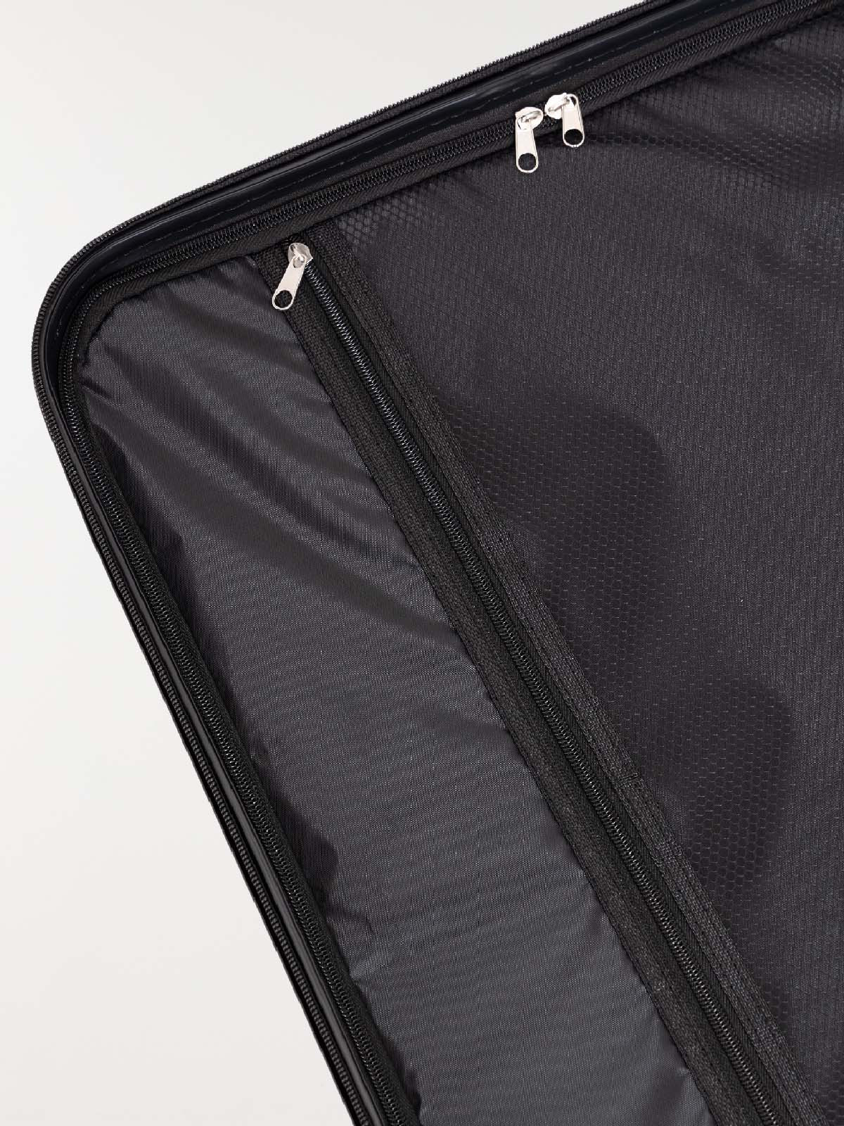 Valise rigide argentée à roulettes Valise rigide argentée à roulettes