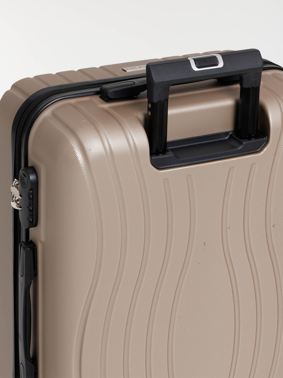 Valise rigide champagne à roulettes Valise rigide champagne à roulettes