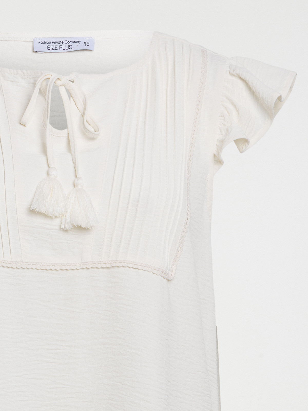 Blouse liens pompons grande taille femme