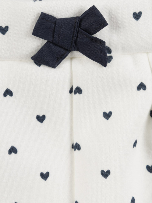 Pantalon écru motif coeur...