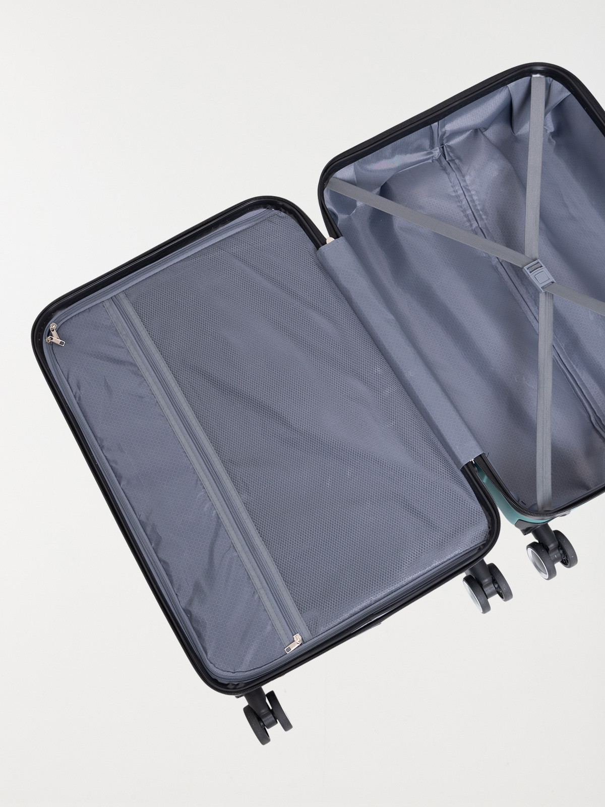 Valise verte rigide à roulettes