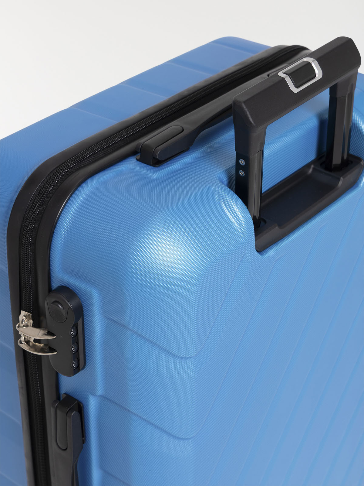 Valise rigide bleue à roulettes