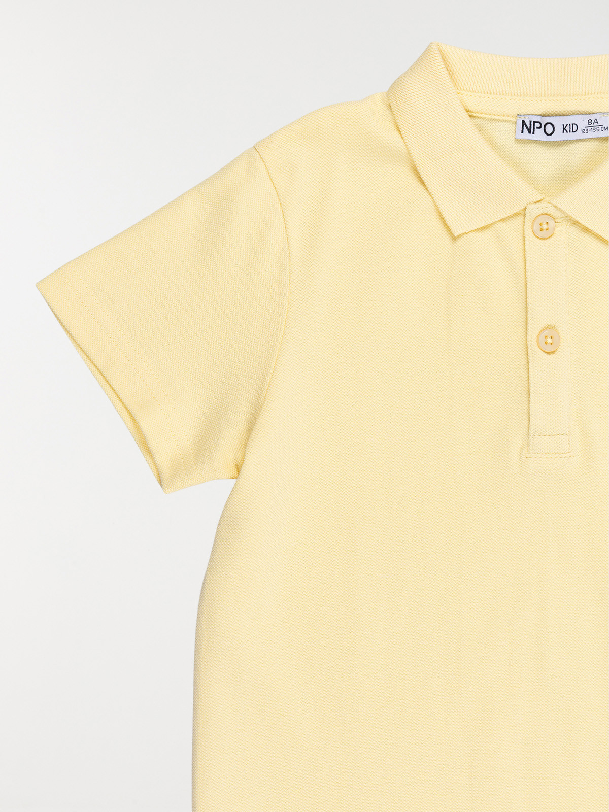 Polo uni jaune doux garçon (3-12A)