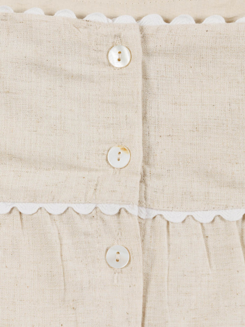 Blouse sans manches noeud...