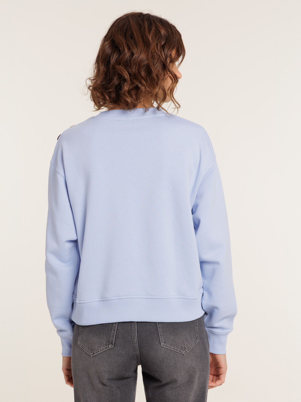 Sweat boutons épaule femme