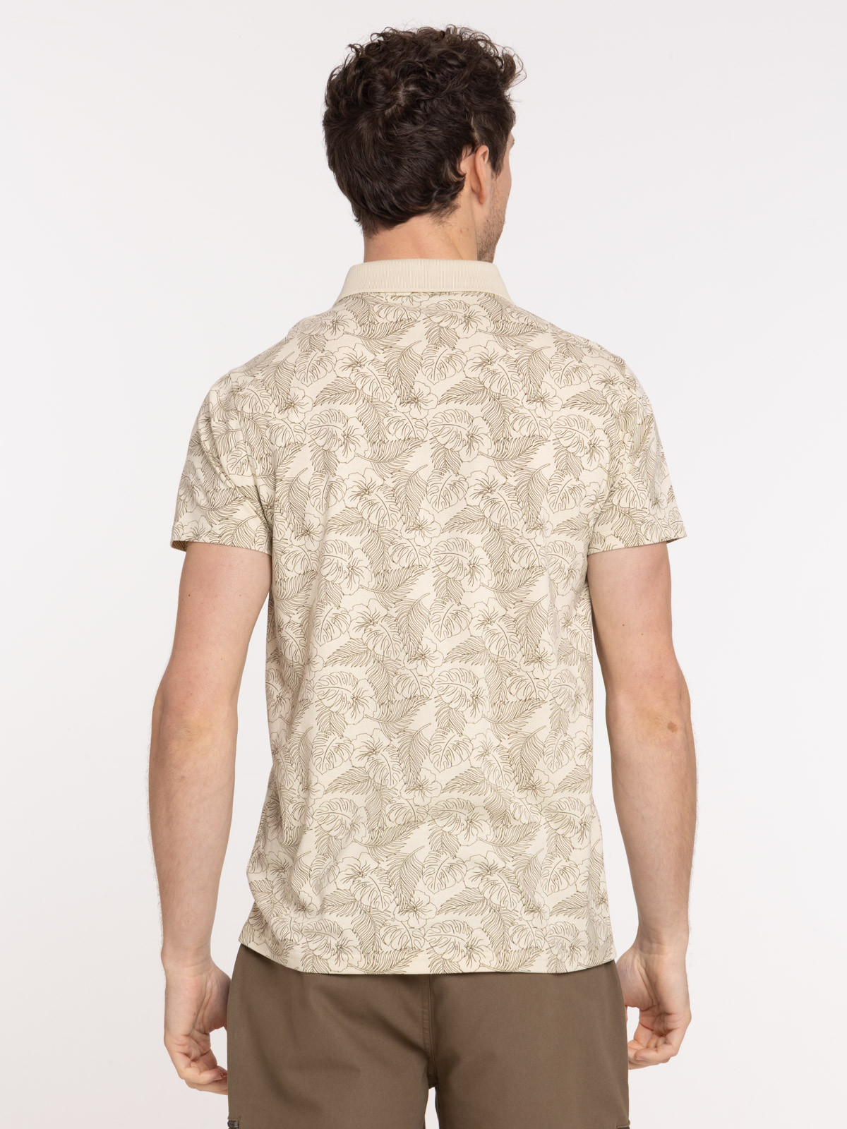 Polo motif feuille tropicale homme