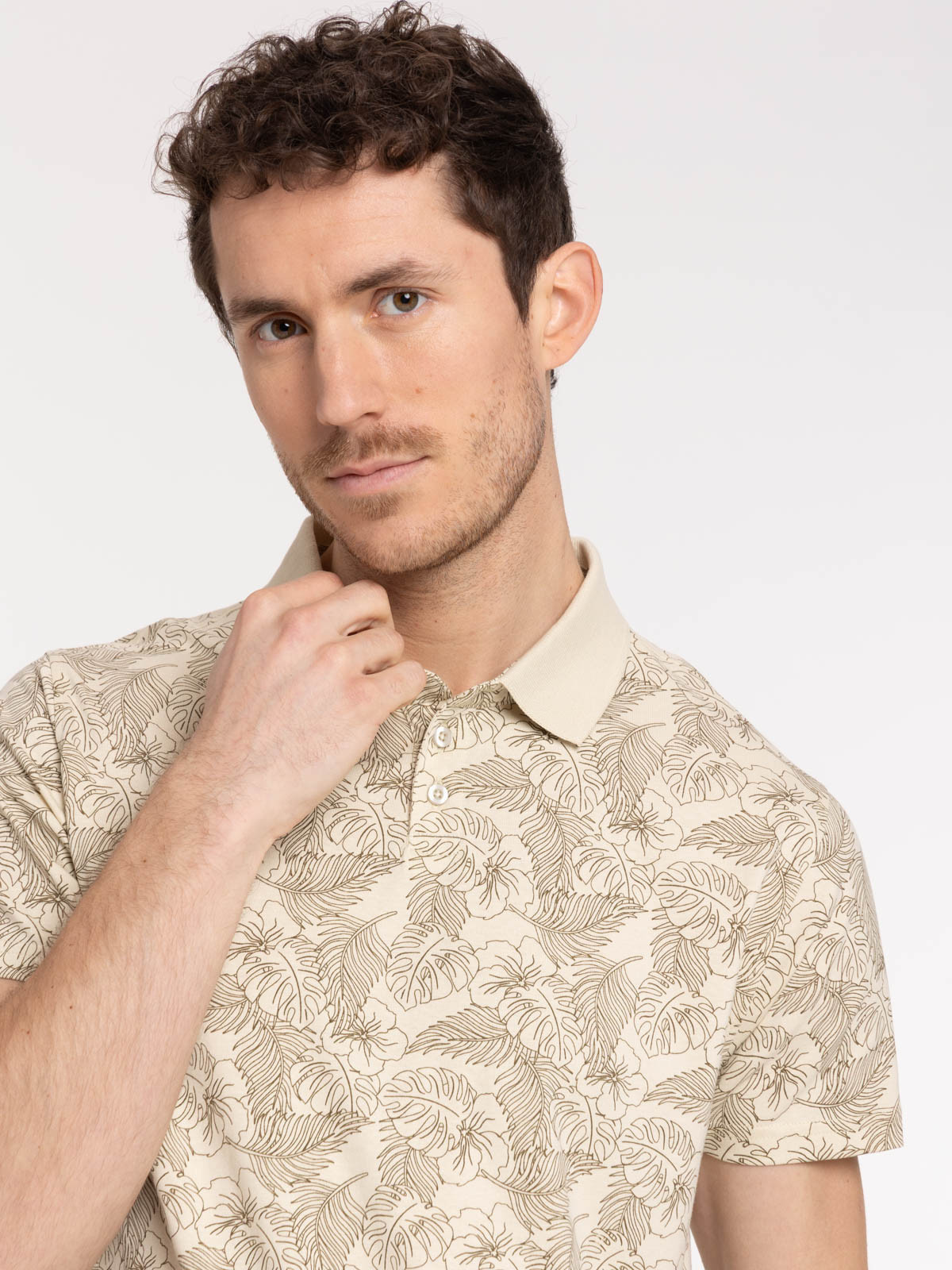 Polo motif feuille tropicale homme