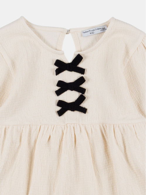 Blouse col rond avec nœuds...